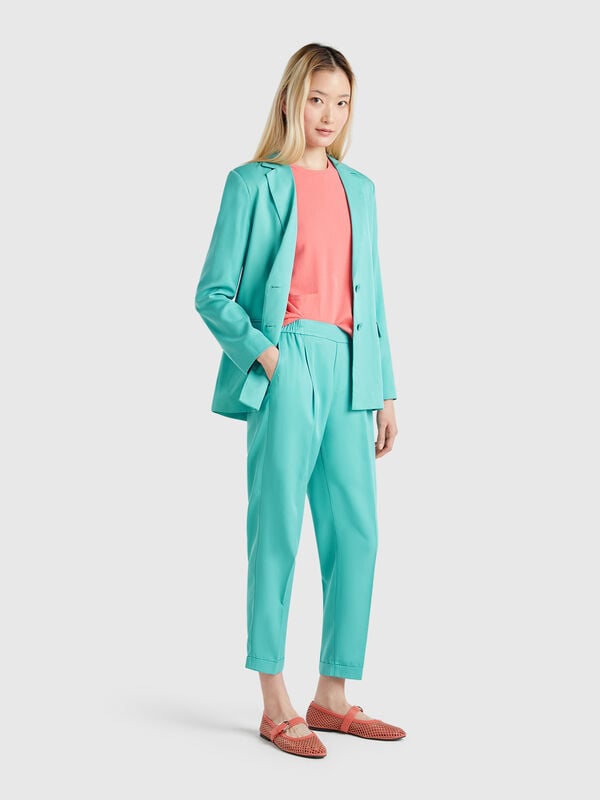 Pantalón fluido con puños Mujer