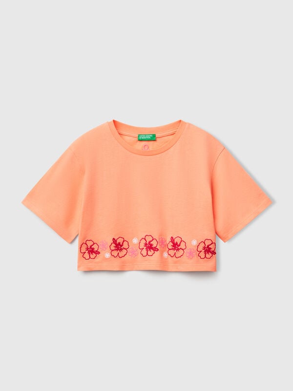 Camiseta naranja con bordado de flores Niña