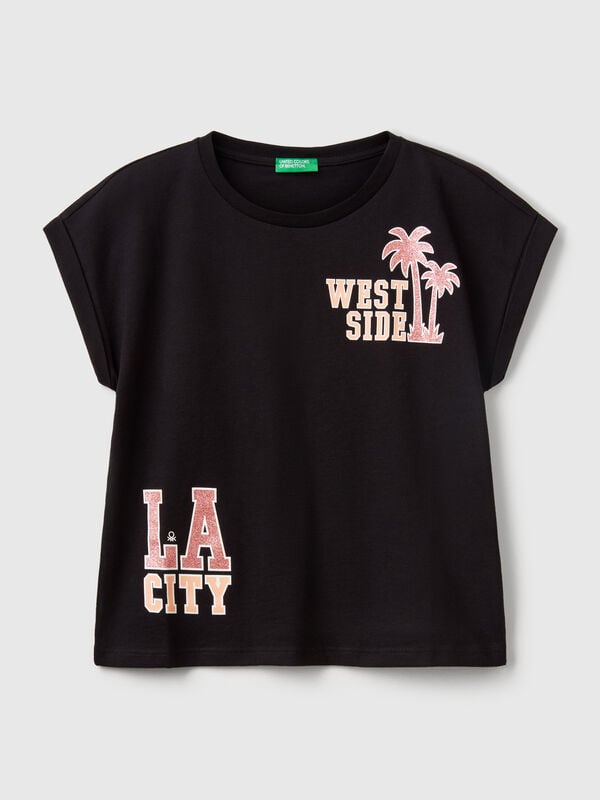 Camiseta boxy fit con estampado y purpurina Niña