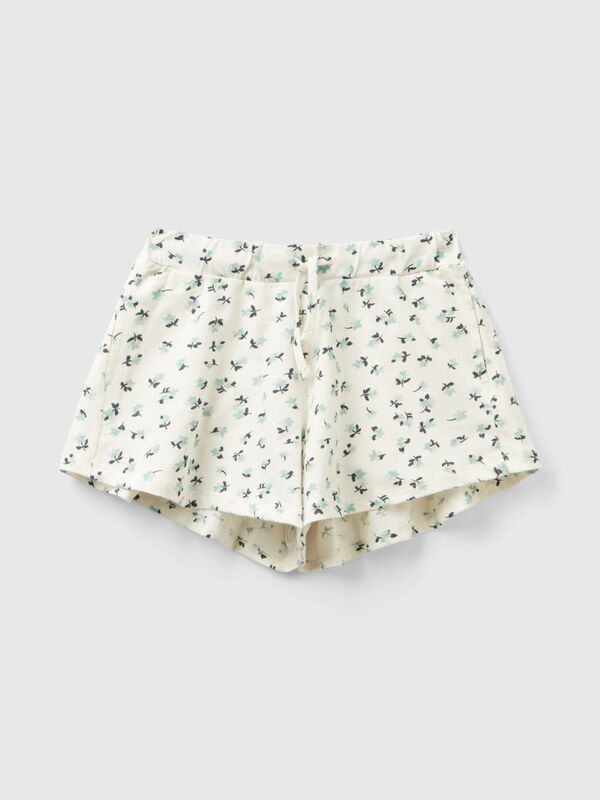 Pantalón corto blanco con estampado floral Niña